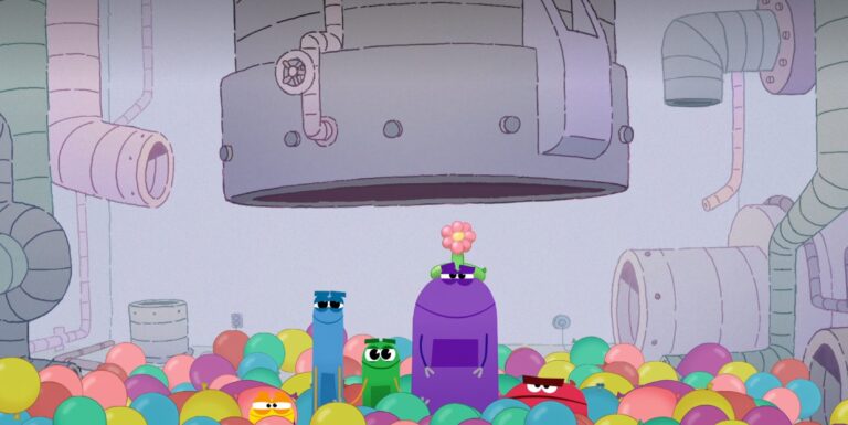 Cartoon characters stand in a colorful ball pit inside a factory. Above them hangs a large, gray machine. One character is wearing sunglasses, and another has a flower on its head. Pipes and industrial features are visible in the background.